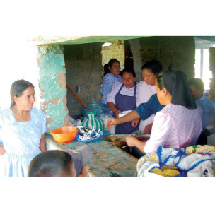 Ladies serving a delicious meal after the baptismal service.