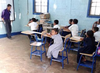 Ricardo in front of his students