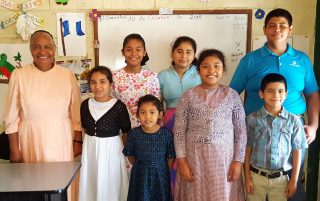 Hortencia López, a twenty-nine year veteran of the classroom, with her students.