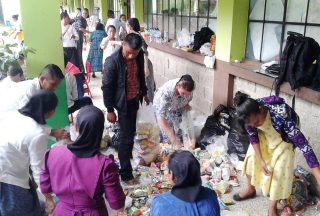 Sorting relief goods for volcano eruption victims.