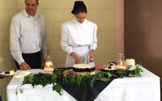 Larry and Laresa serve cake at their Guatemalan reception.