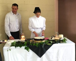 Larry and Laresa serve cake at their Guatemalan reception.