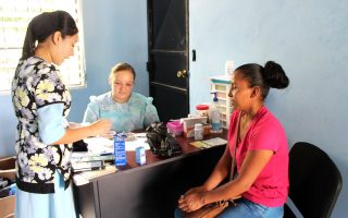 Marleny Molina and Lynelle Stutzman see a patient